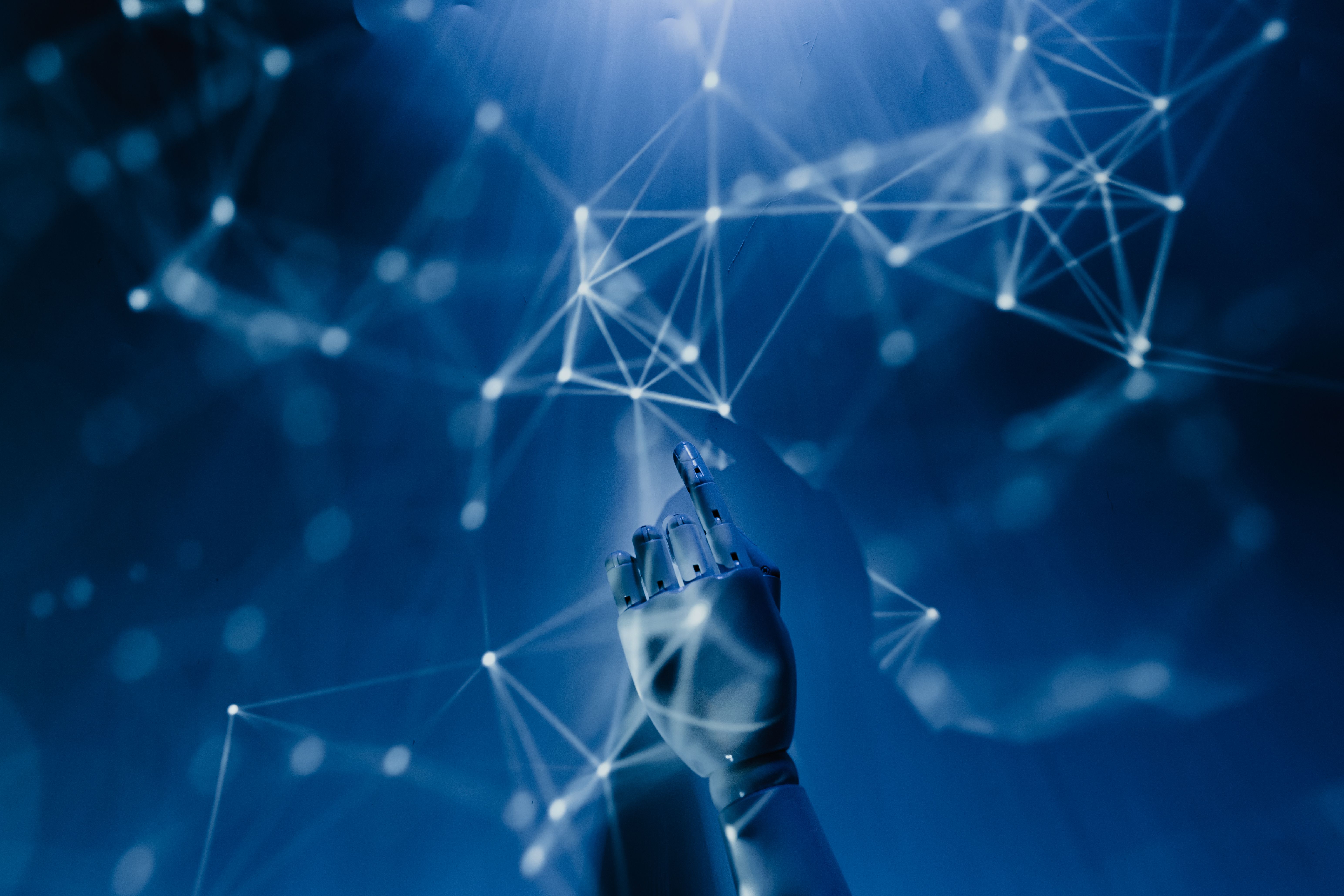 Robotic hand reaching into a digital network, symbolizing AI-generated content